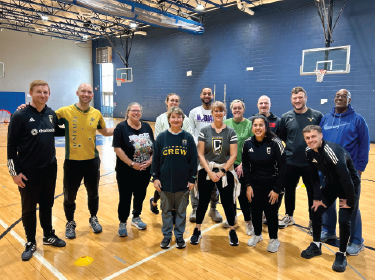  group of teachers with soccer professionals